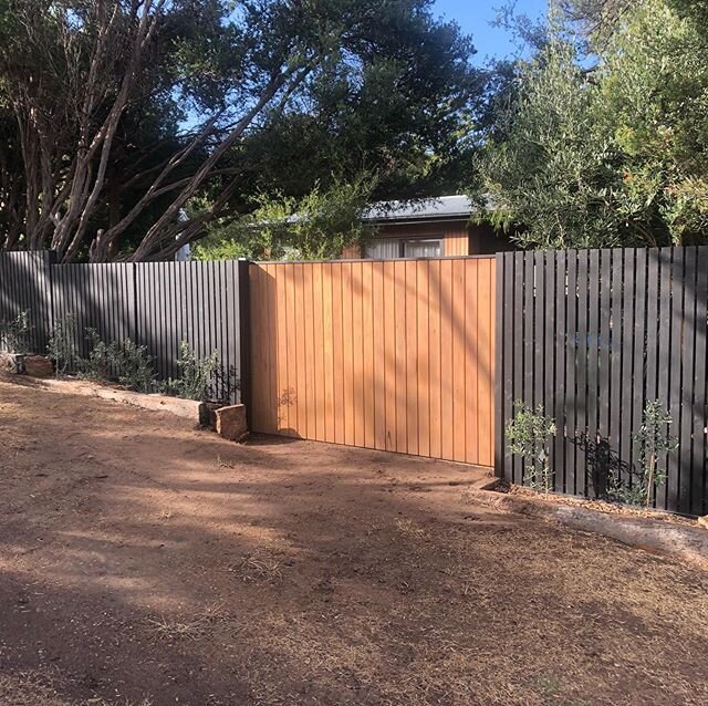 Sliding gate matching the house timber with a standard picket front fence