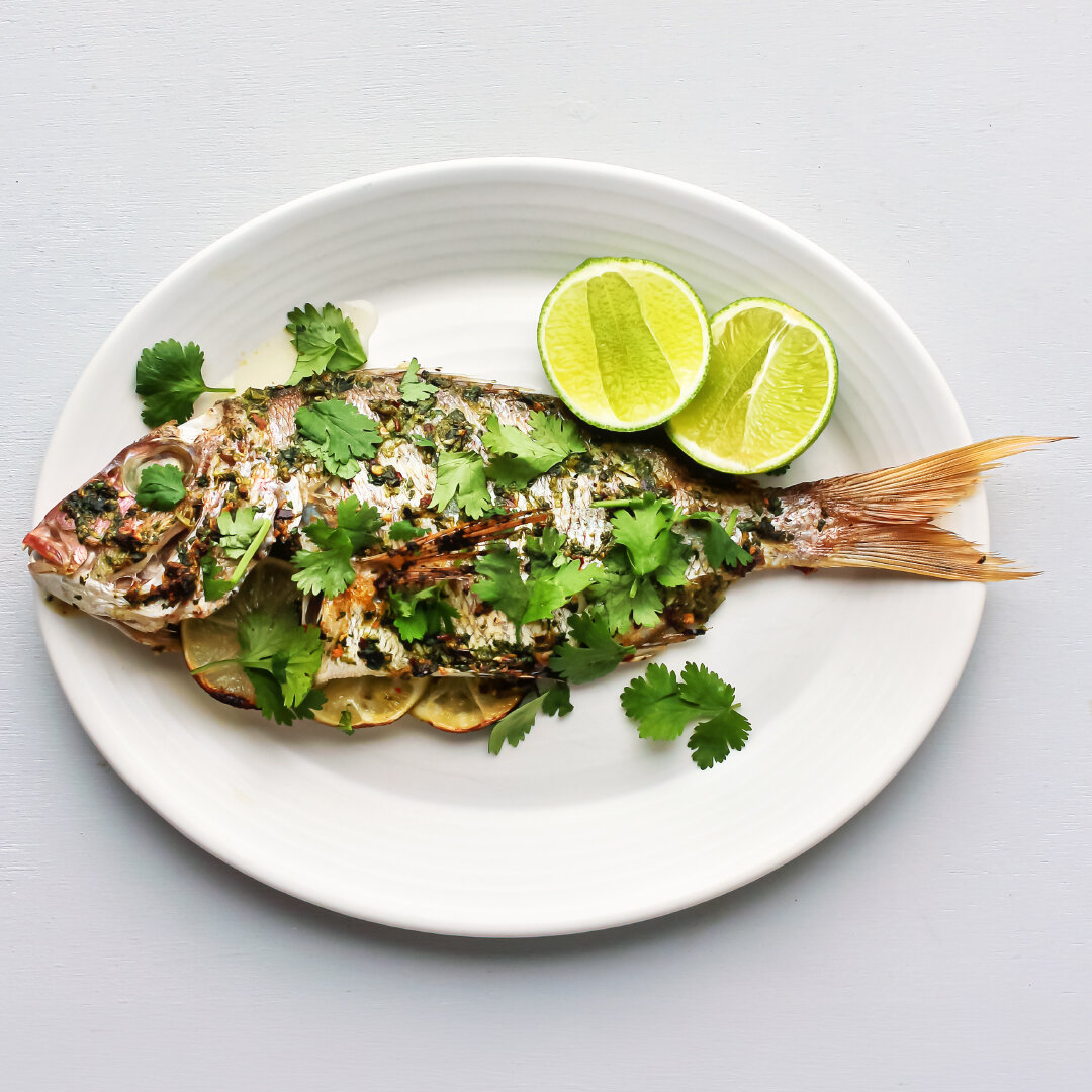 The original fast food.

While the oven heats up, I whizz together a headily aromatic paste of coriander, garlic &ndash; lots of both &ndash; ginger and chilli. This gets brushed all over the fish, inside and out, and some slices of lime go into the 