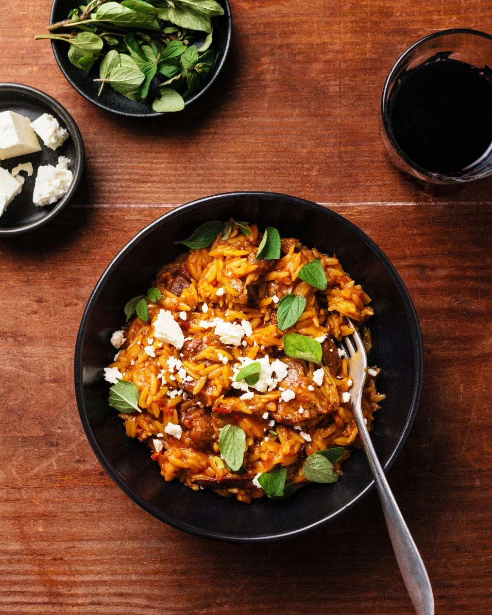 Sunday night taverna special, yiouvetsi, slow-cooked lamb with orzo, feta and oregano, and sneaky heat courtesy a few tiny dried Calabrian chillies.