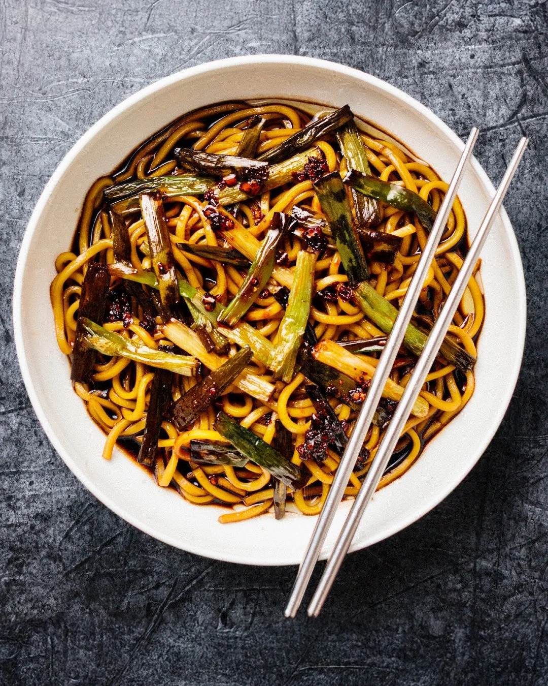 Burnt spring onion oil with hokkien noodles.

A bit of soy sauce and black vinegar are supporting players here, but the star is the oil, flavoured by spring onions fried until the thinnest parts are dark and crisp.