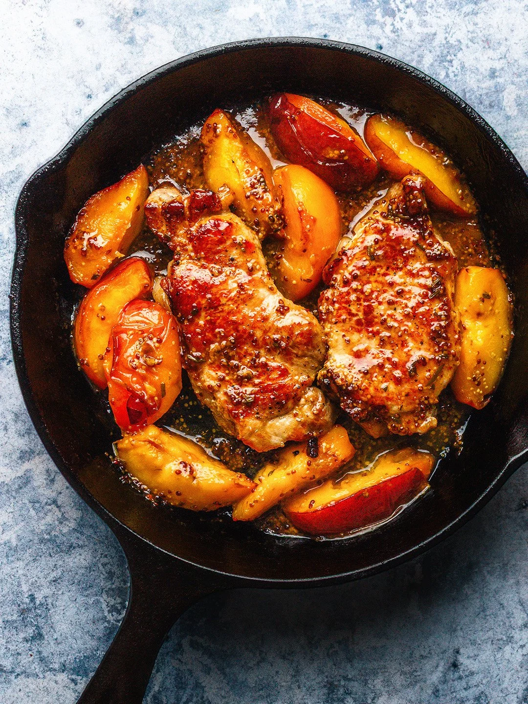 Pork steaks and nectarines, with a pan sauce of wholegrain mustard, cider and rosemary. 

A great, quick weeknight dinner during our short nectarine season (and it's a good one this year) and absolutely required eating after the year's first working 