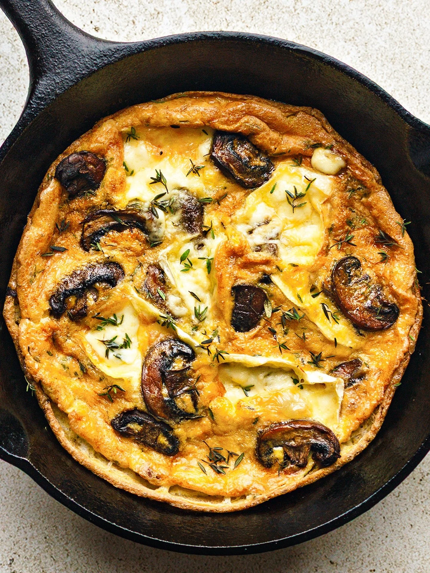 Fridge-clearing frittata for lunch: mushrooms, camembert, thyme.
