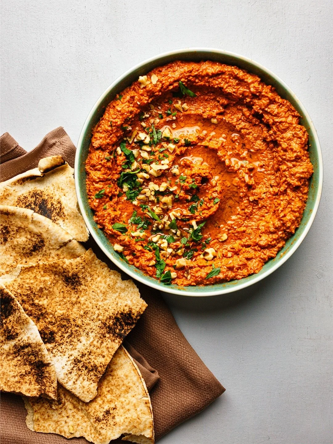 Muhamarra, a delicous mezze (or spread, or sauce) from Syria, made with roasted red peppers, walnuts and pomegranate molasses.