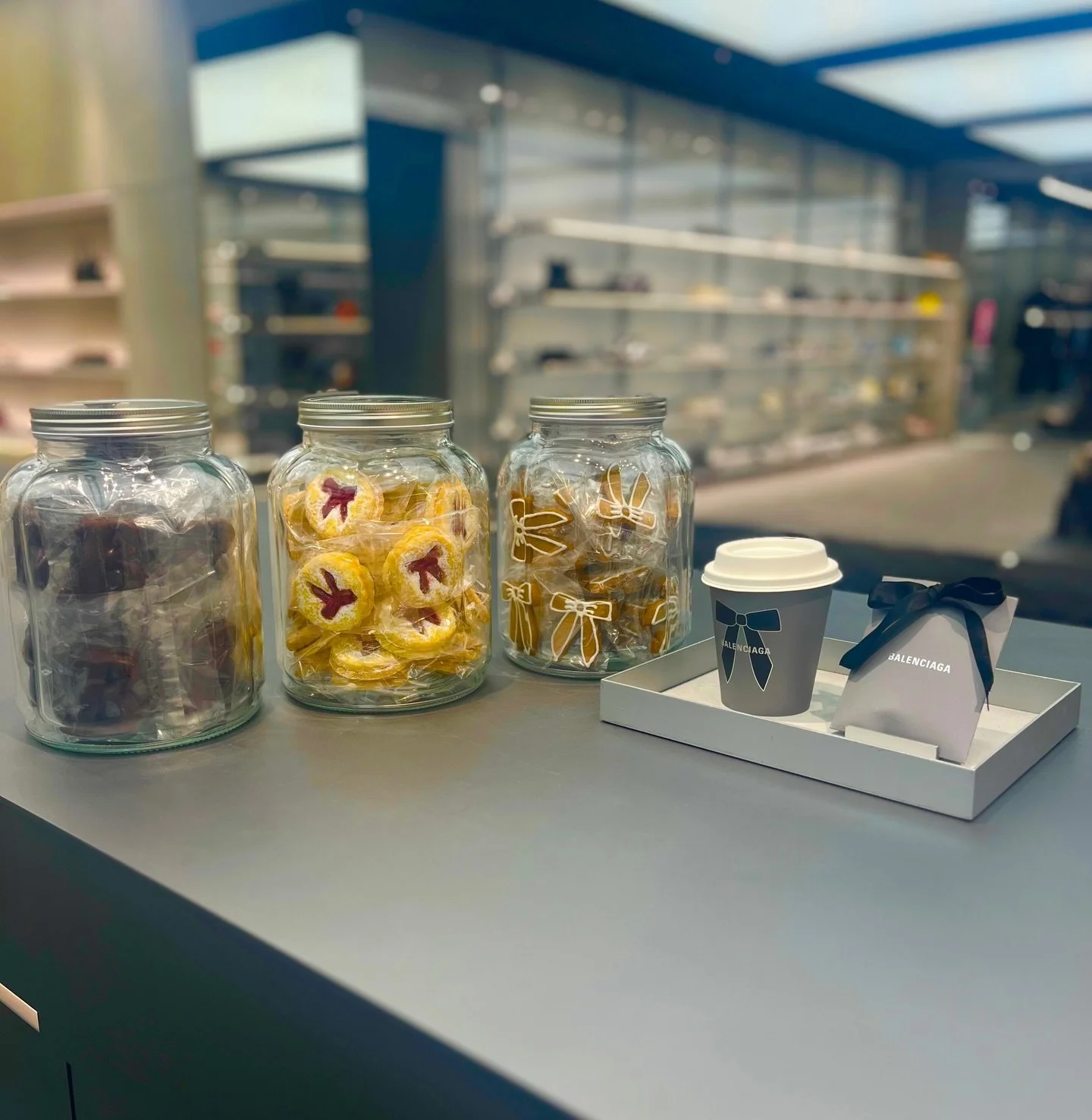 Our cookies have officially landed inside the Balenciaga Collins St store and we are absolutely losing it 🤍🔥 @balenciaga 

From jars of bows to the matching Balenciaga coffee cups and cookie bags&hellip; it&rsquo;s the chicest snack break you&rsquo