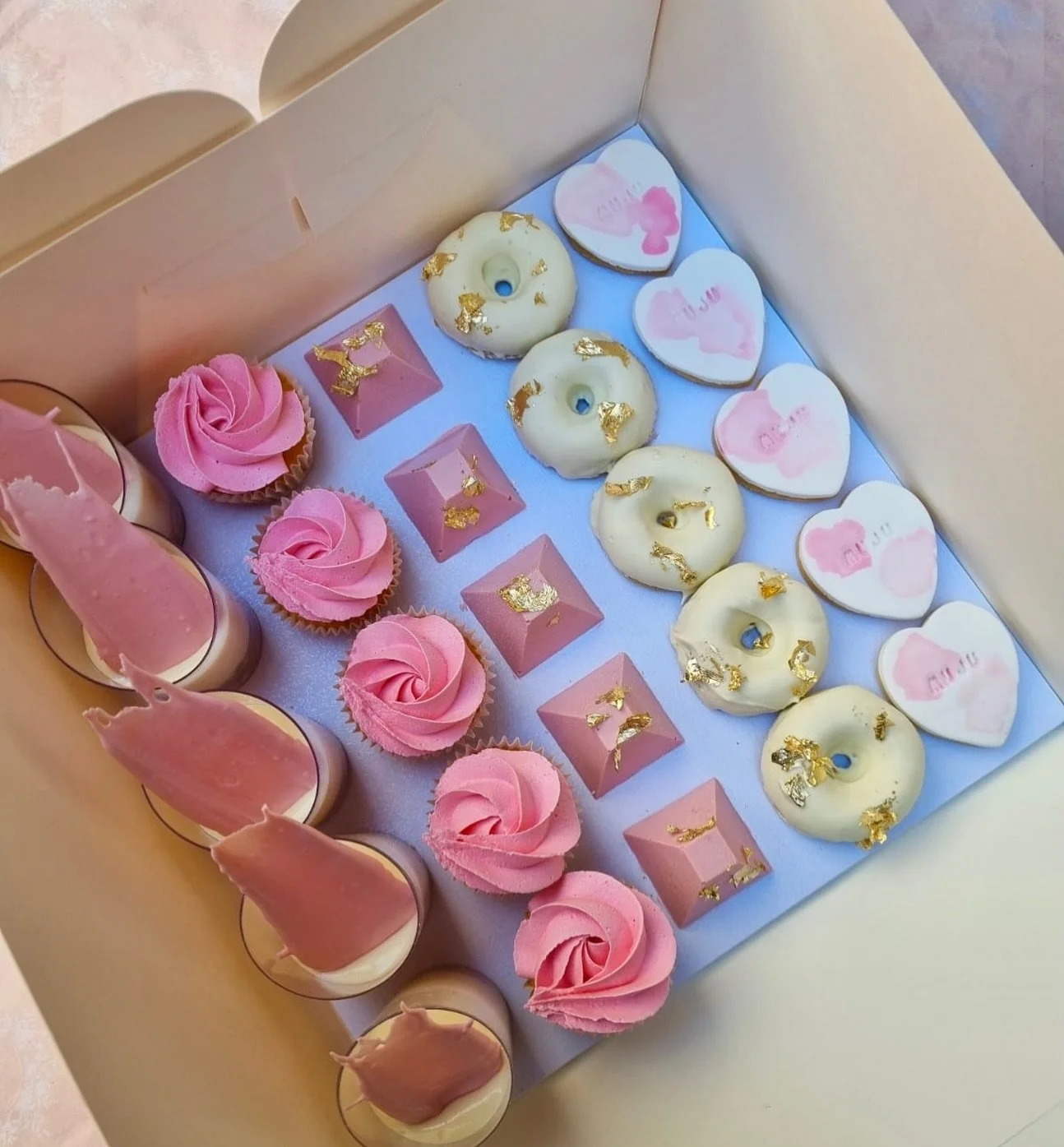 Party board perfection 🎀✨

Pink dreams, white chocolate moments &amp; a little sprinkle of gold 💕
From swirl cupcakes 🧁 to iced donuts 🍩, choc shards 🍫 and sweet little cookies 🤍 &mdash; this board is made for celebrating in style!

Perfect for