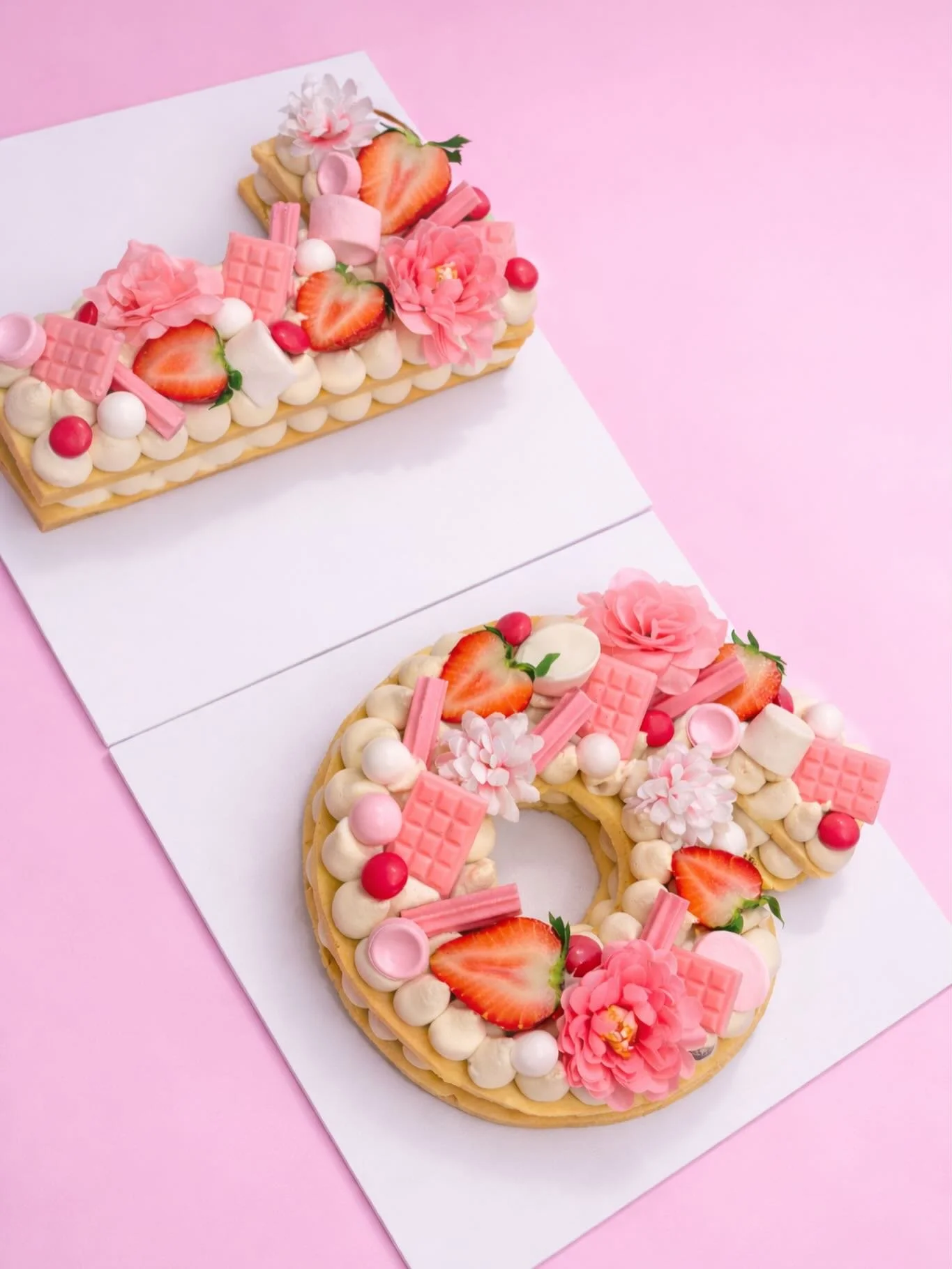 Pastel perfection in every bite 💕✨

Our sweet 16 Cookie Cake is layered with vanilla bean cream, fresh strawberries, pink chocolate, fluffy marshmallows &amp; the prettiest florals 🌸🍓🍫

Soft. Feminine. Completely irresistible.

The ultimate centr