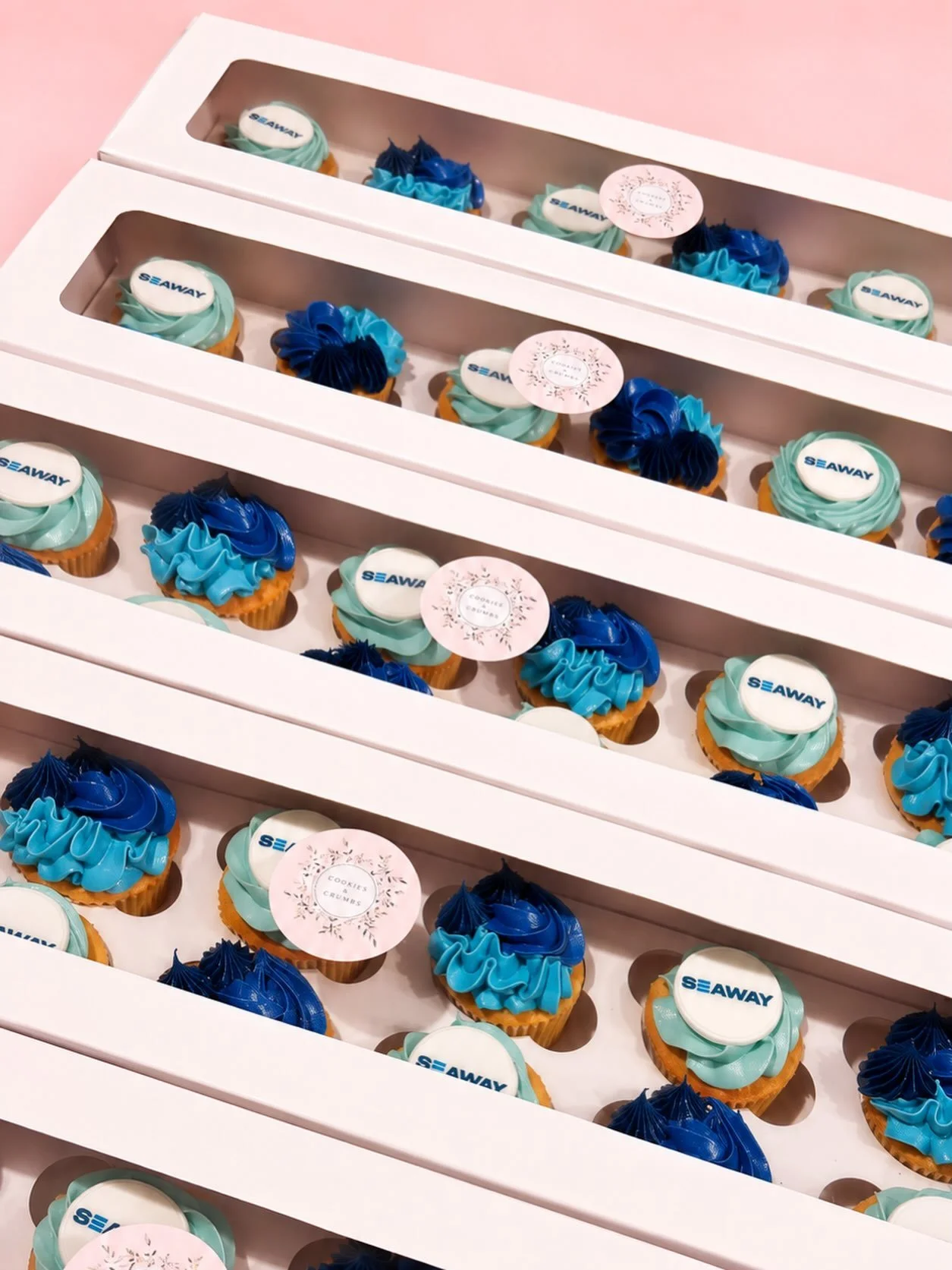 Corporate cupcakes, but make them delicious 💙🧁

A sea of custom SEAWAY cupcakes in the perfect shades of navy, blue &amp; aqua ✨ Branded with edible logo toppers and ready to impress!

Perfect for corporate events, launches, office celebrations &am