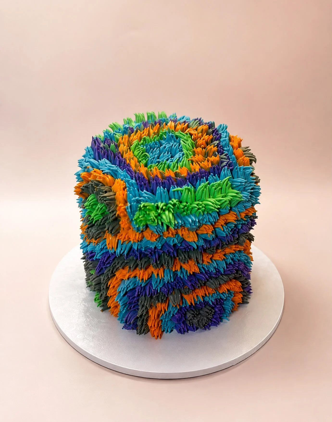 Texture, colour and a whole lot of personality 🌈✨

This custom shaggy cake was made to stand out &mdash; bold, bright and completely one of a kind. 🎂💙💚🧡💜

#customcakemelbourne #melbournecake #shaggycake