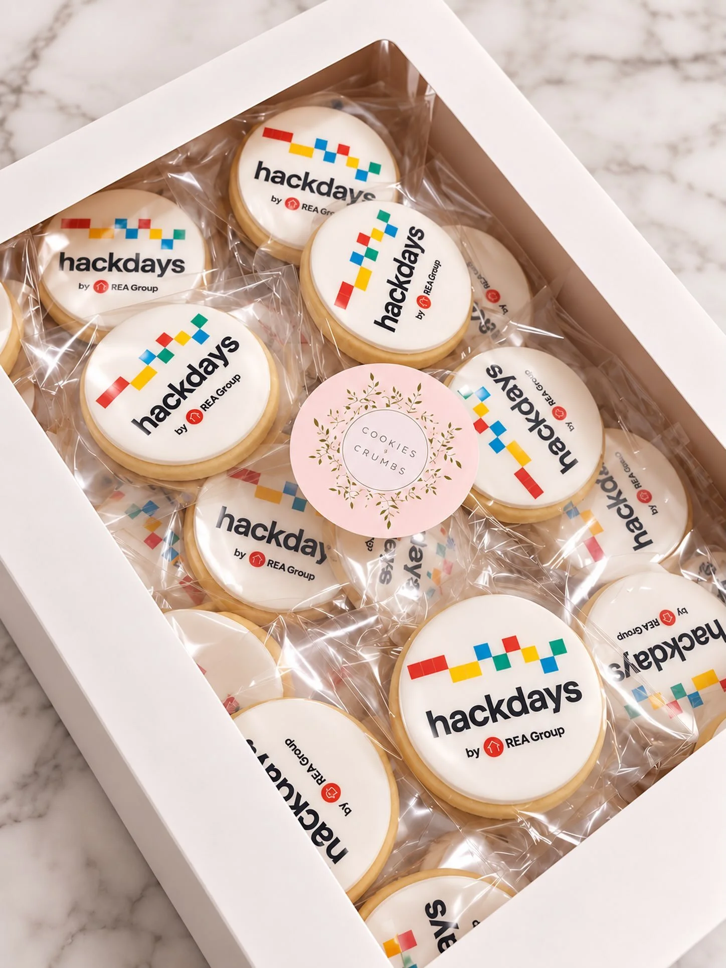 Hackdays, but make it sweet. 🍪✨ @realestateaus 

Custom logo cookies created for REA Group Hackdays &mdash; individually wrapped, branded and ready to make an impression.

Corporate cookies, the Cookies &amp; Crumbs way. 🎀

#corporatecookies #logoc