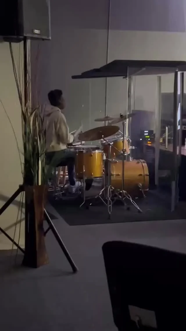 Dude looking big behind the drumset now!