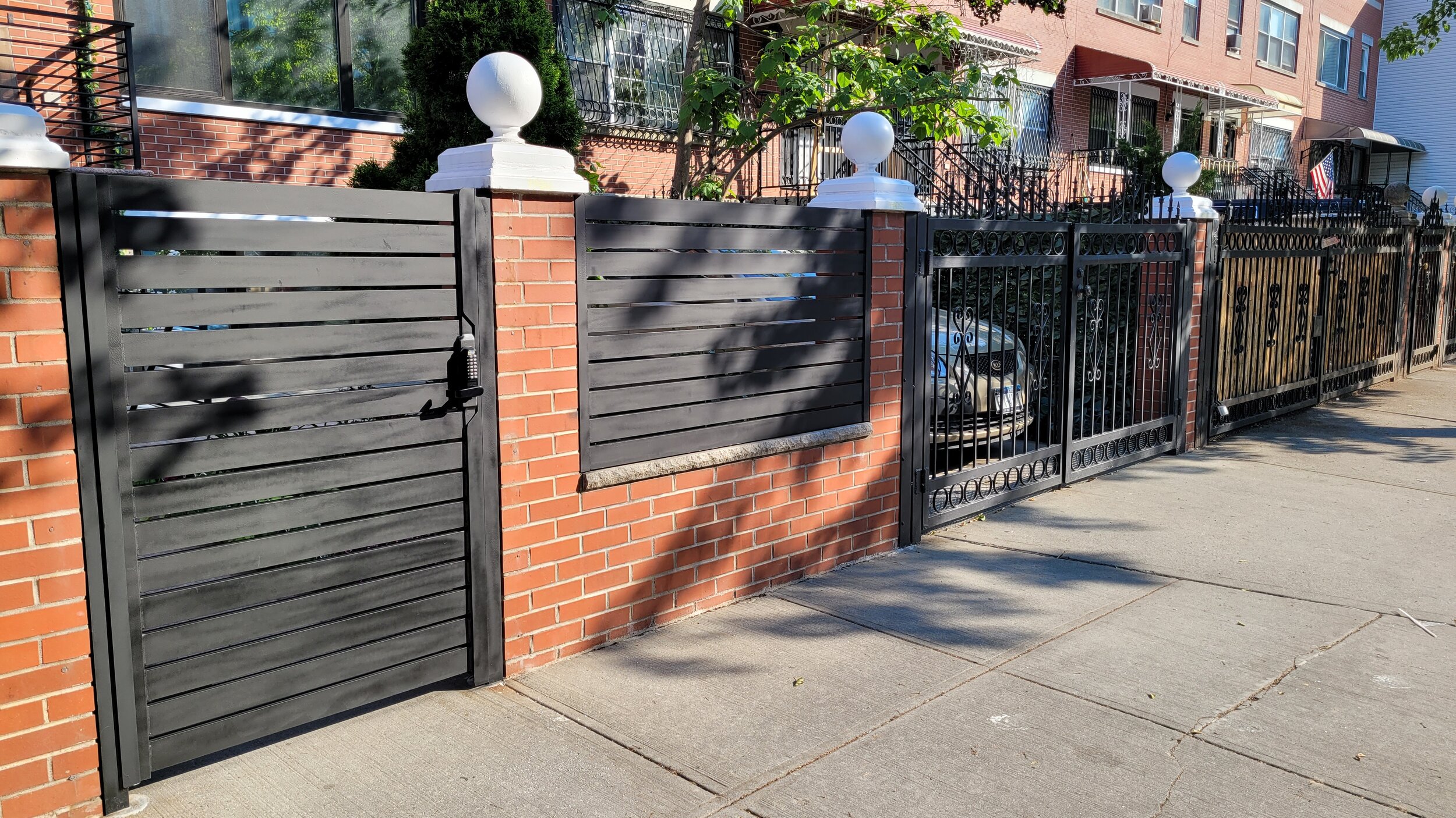 Door and gate with a brick wall