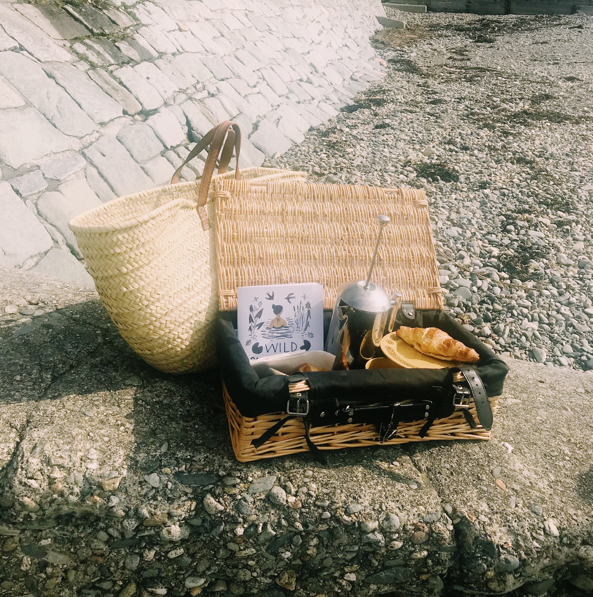 Beach picnic essentials - coffee, carbs and the wild swimming book