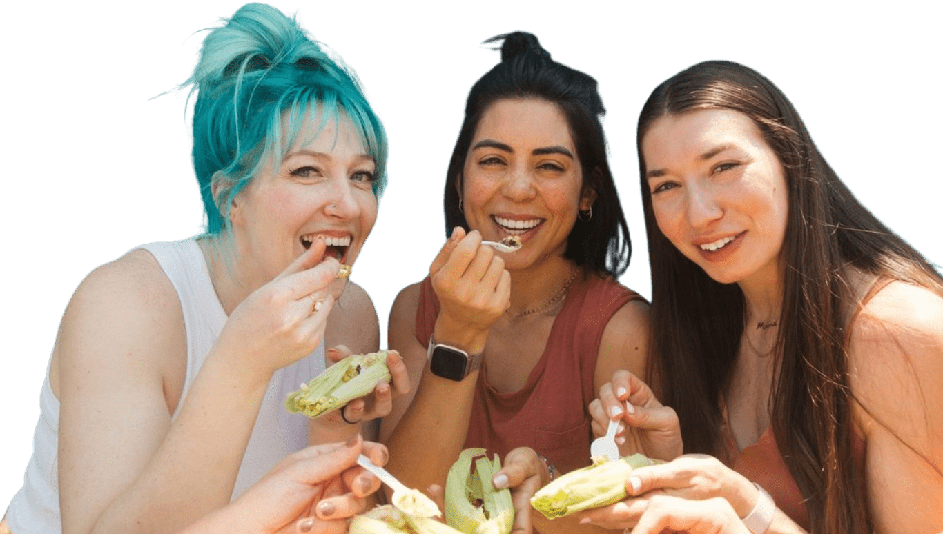 Whitney, Kate, and Diana eating elote