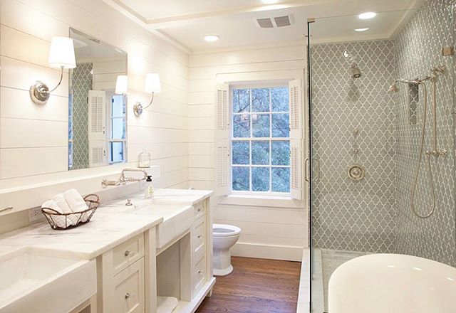 Classic bathroom with some great character details. Especially love the wall mount faucets with apron sinks.
