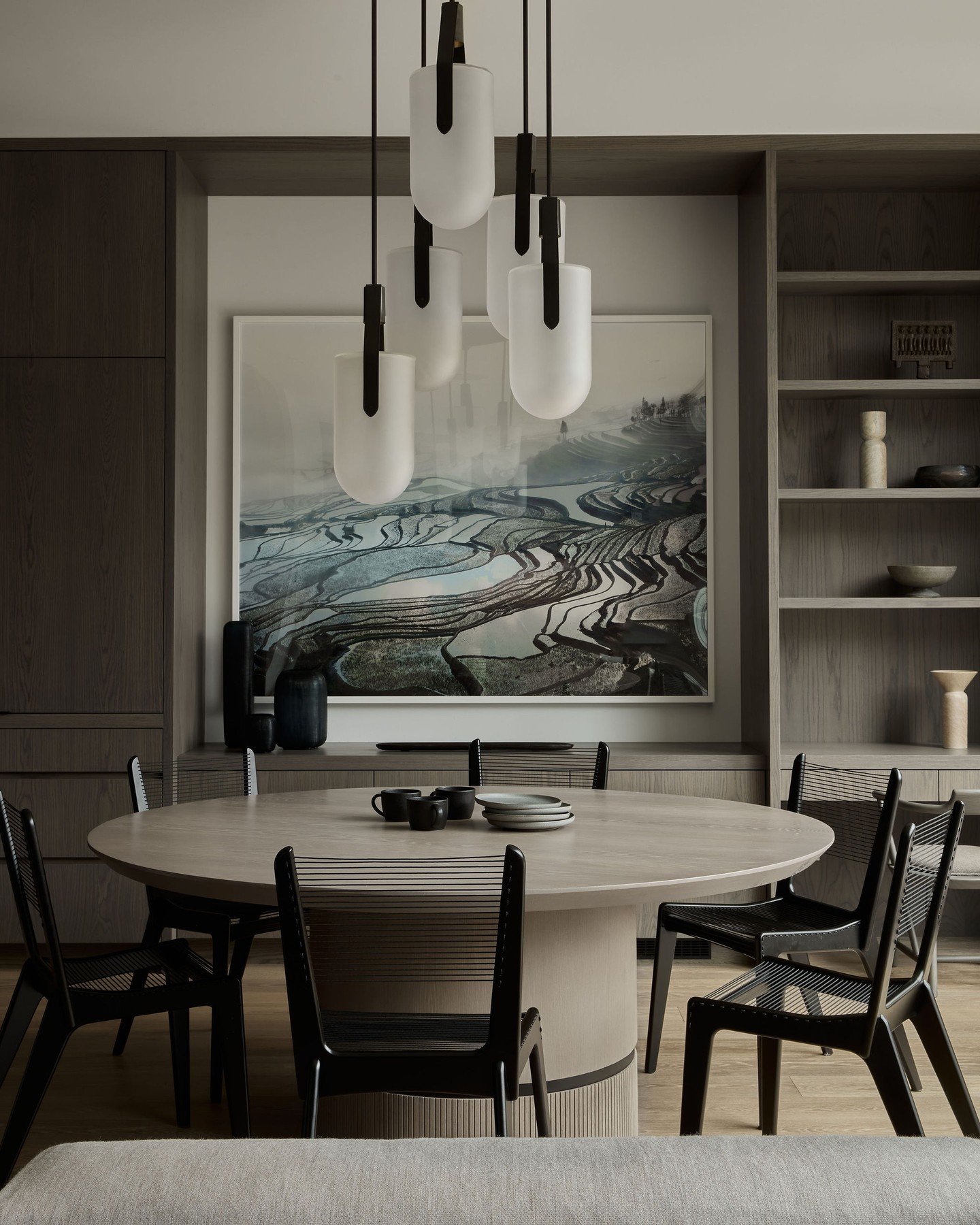 Repost @kimlambertdesign Acquired during the ideation phase, we designed our millwork to feature this stunning photograph by @david_burdeny to sit centre stage, and selected these beautiful pendants and chairs to compliment the backdrop.

Pendants by