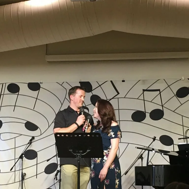 Married couple Ryan & Angela singing a love song to one another at our Cabaret Fundraiser Night 2018.