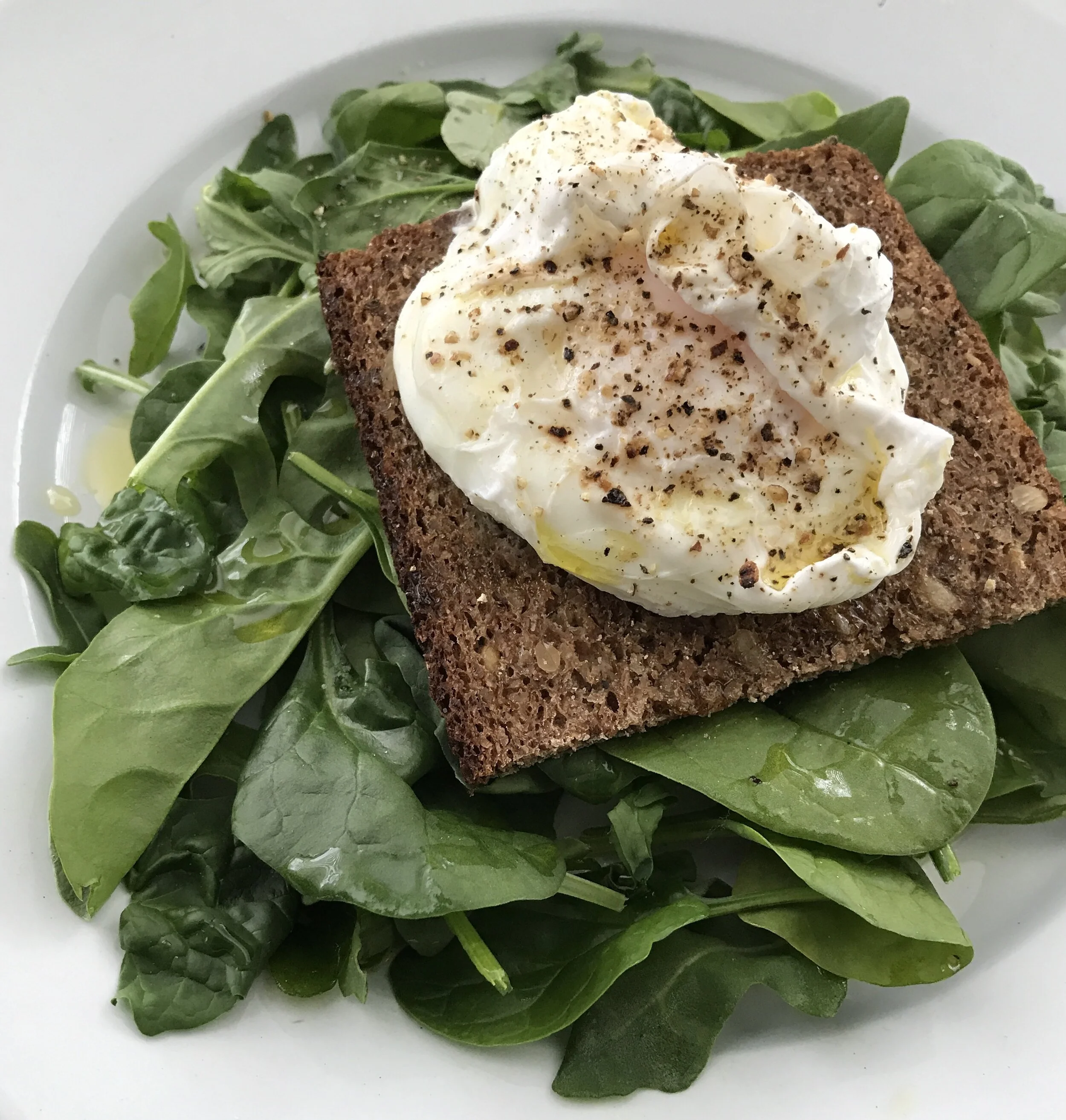Poached Egg on German Bread with Spinach &amp; Arugula