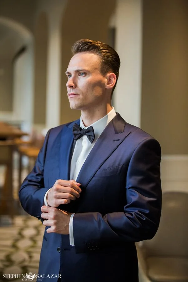 groom wearing blue armani suit