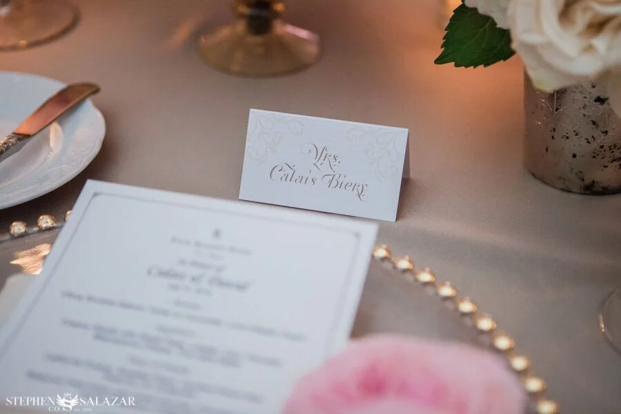 menu card and place card on a charger plate