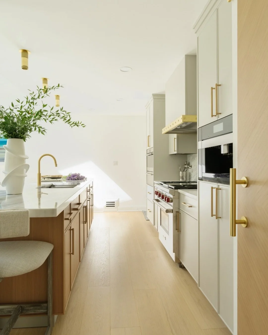 In this kitchen Soft light, warm wood, and timeless marble work together to create a space that&rsquo;s functional and inviting