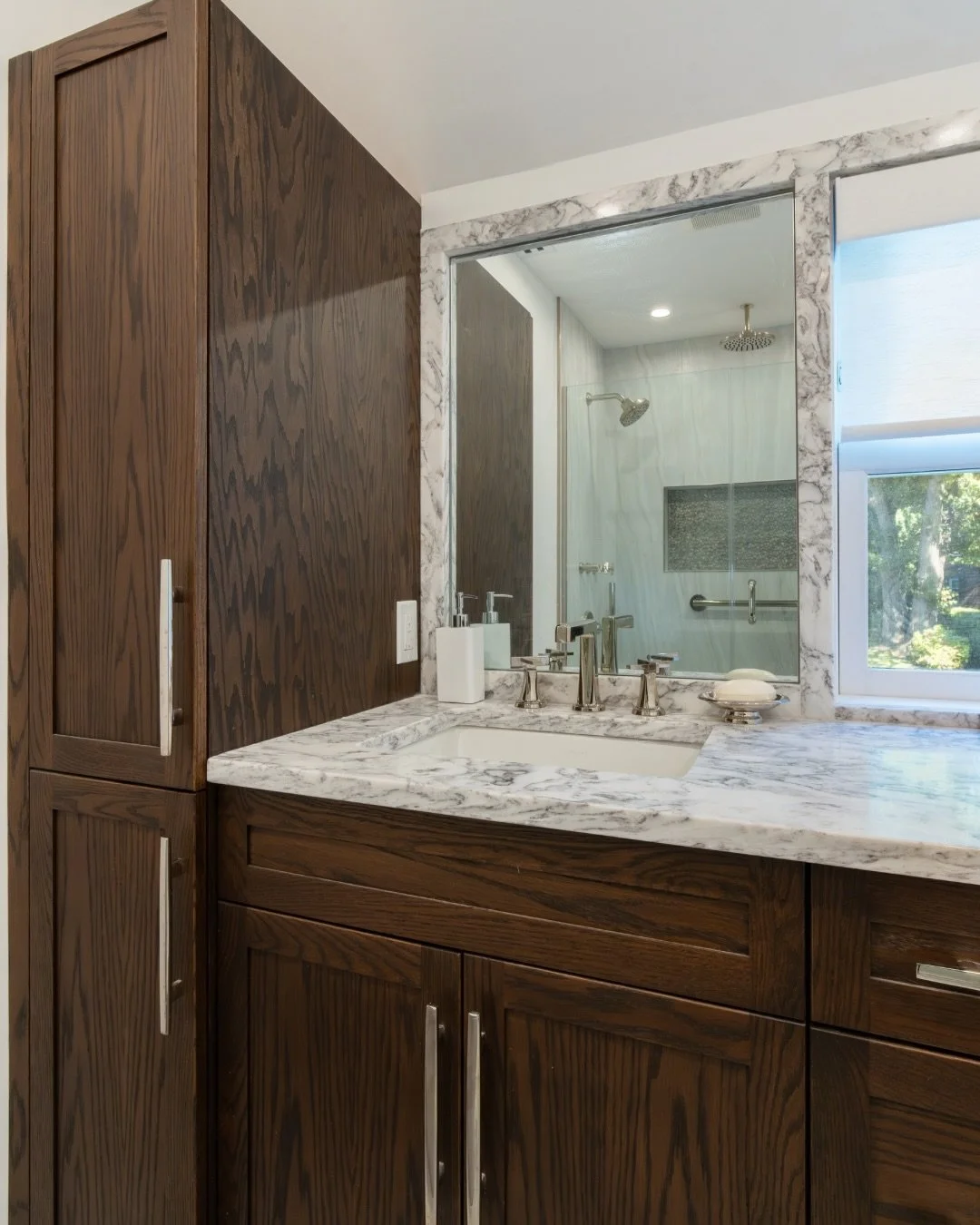 Dark wood, custom cabinetry, and a balance of tile and stone.

All coming together to create a bathroom that feels as good as it looks.