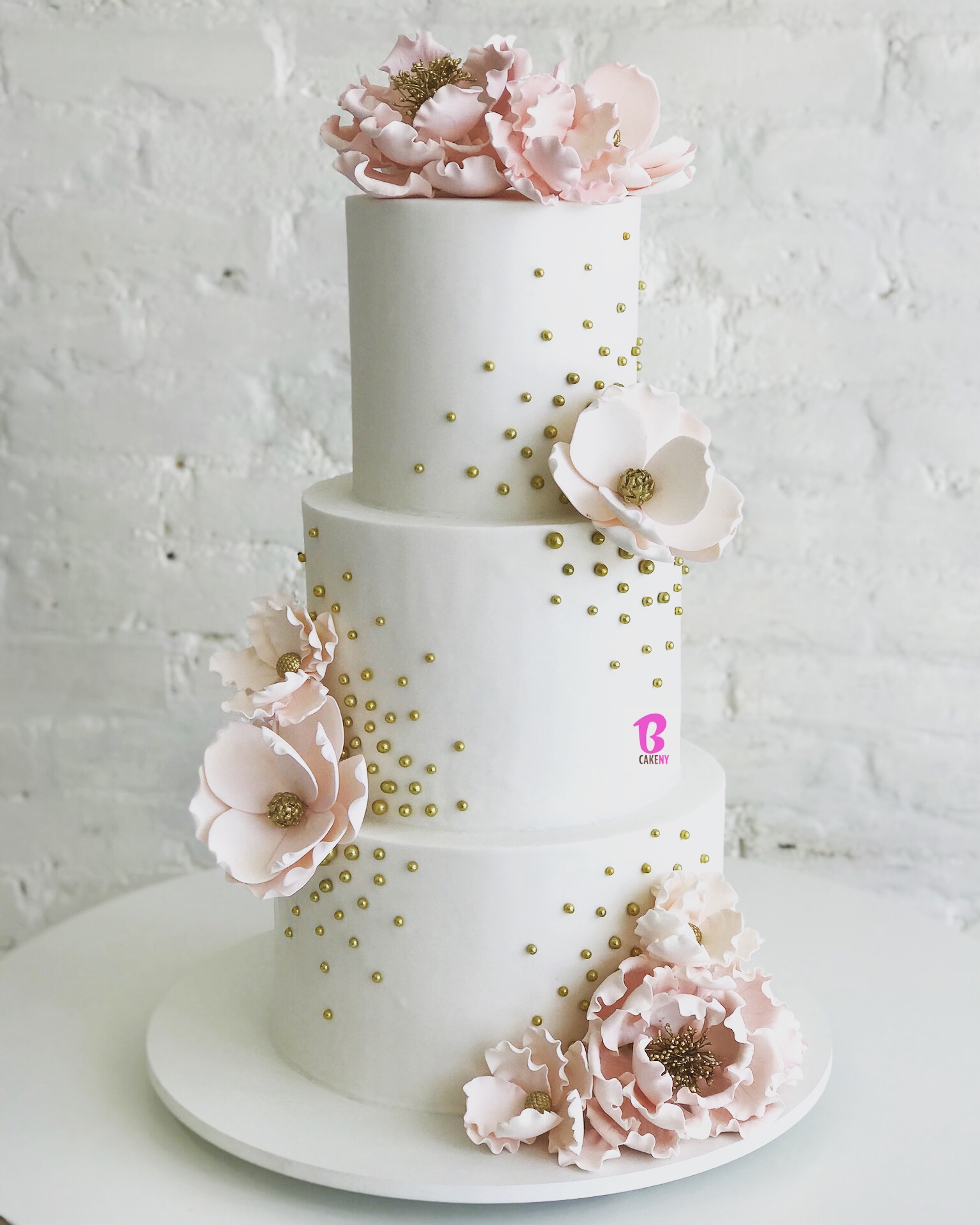 white fondant cake with sugar flowers