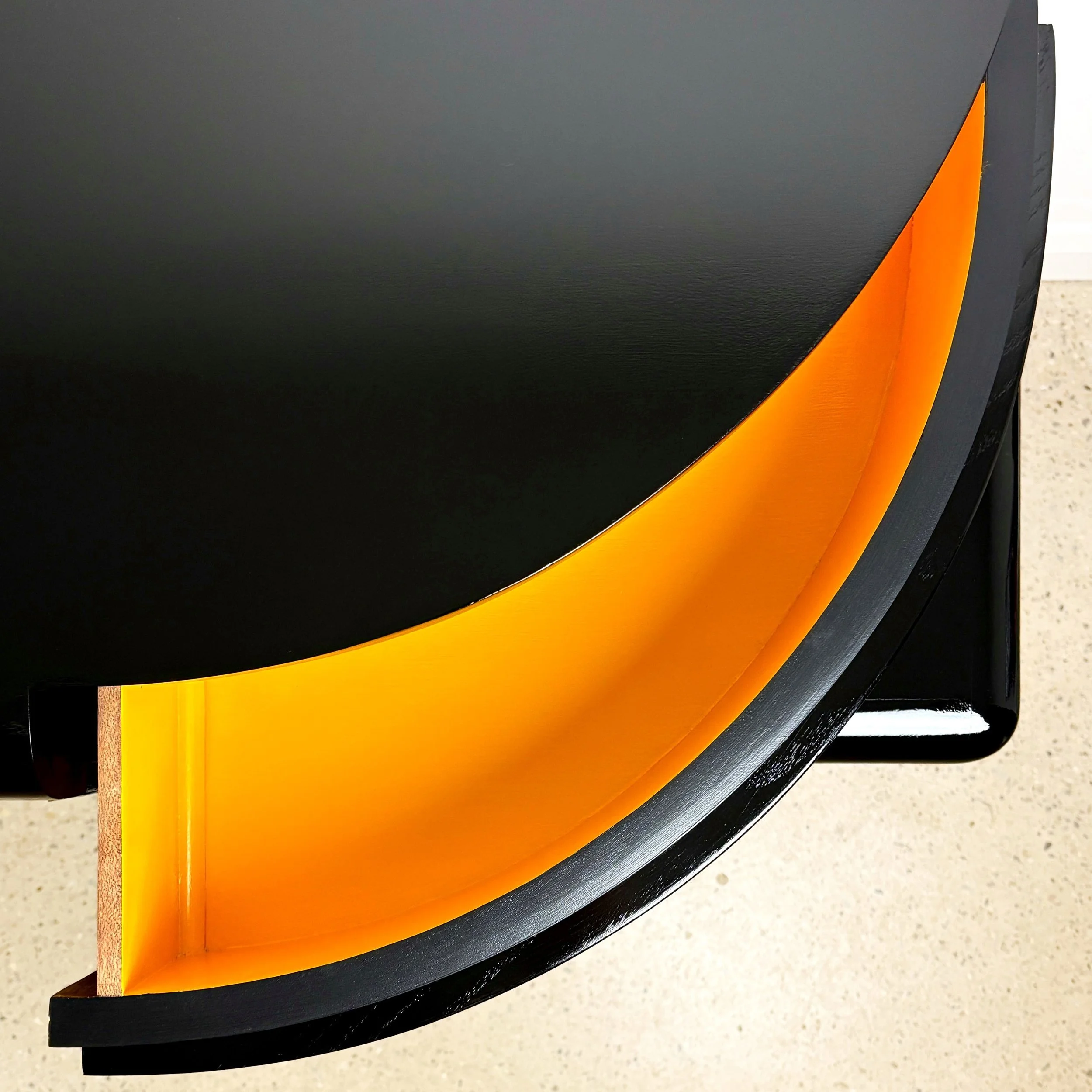 high_gloss_black_cabinet_with_orange_pop.jpg