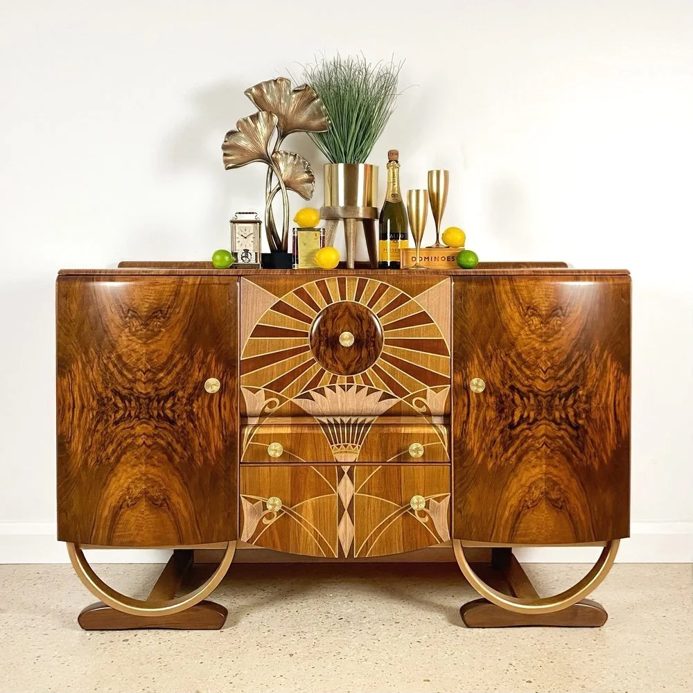    Project No. EP096 - ‘Della’    Art Deco drinks cabinet in walnut by ‘Beautility’ with floral and sun-ray motifl inspired by the elevators within the Chrysler Building, NYC. 