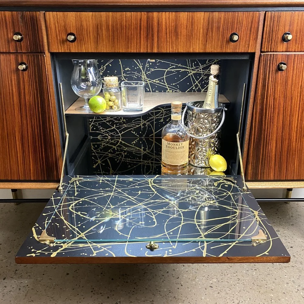 mid-20th-century-heals-zebranowood-sideboard-with-jackson-pollock-splatter-eclectica-projects-view-1.jpg