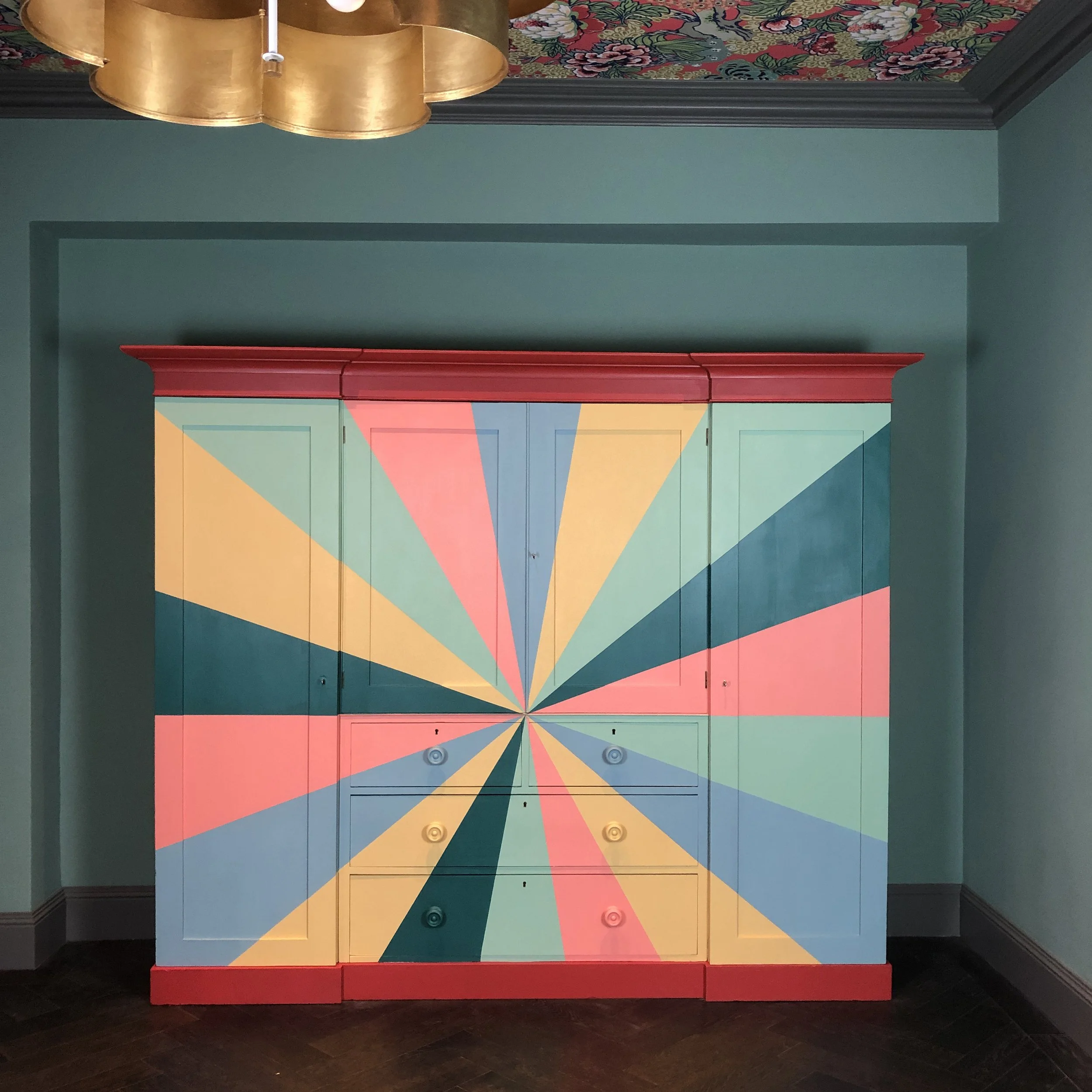    Project No. EP059 - ‘Ellé’    Victorian combination ‘Gentleman’s’ wardrobe with drawers hand-painted in maximalist sunburst design. 