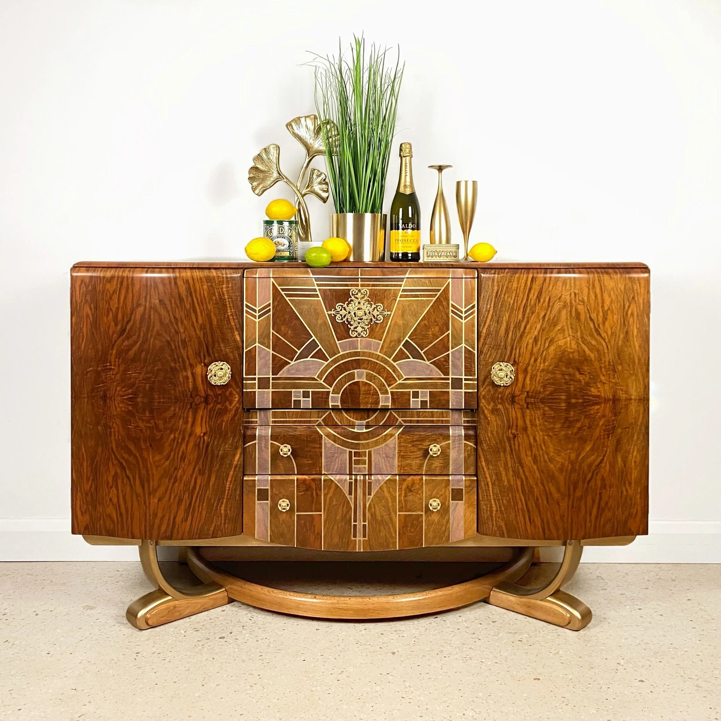    Project No. EP095 - ‘Erin’    Art Deco cocktail cabinet in walnut by ‘Beautility’ with ‘sunrise' wooden inlay-style design with gold detailing. 