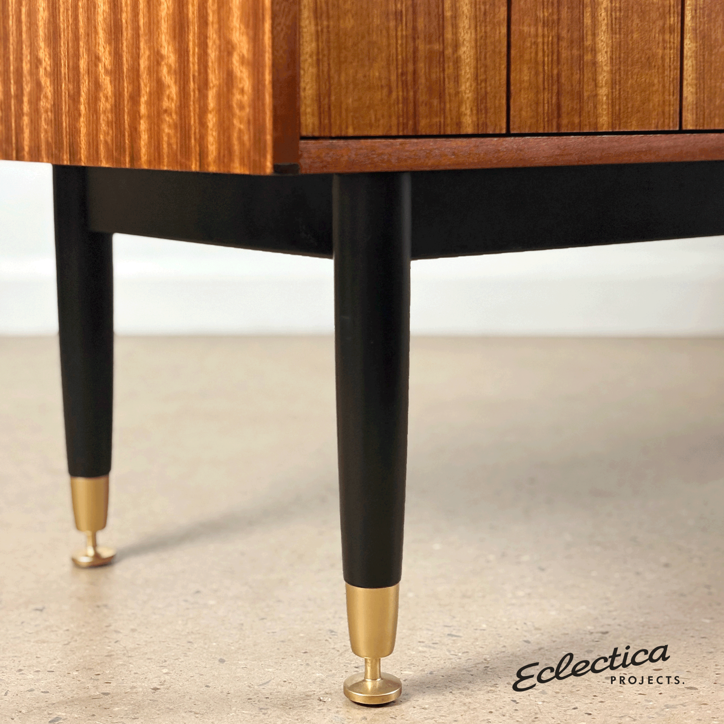 G_Plan_sideboard_with_black_legs_and_brass_feet.gif