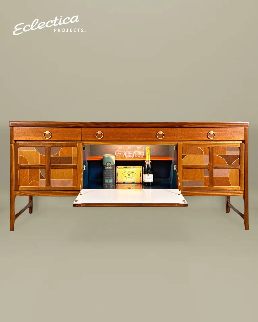 Long_mid_century_sideboard_with_drop-down_drinks_cabinet_by_Eclectica_Projects.jpg