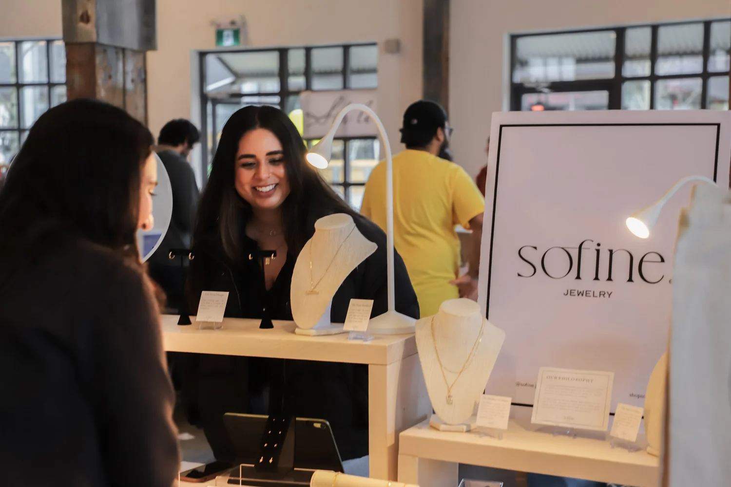 A Made in the 604 vendor meeting customers at a market