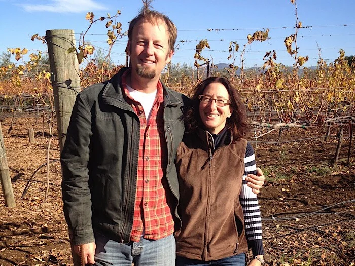 Steve and Jill Matthiasson - Matthiasson • Napa, California Winemaking, for us, is a natural extension of farming. We explore classical expressions of different grape varieties, some well-known like Chardonnay or Cabernet Sauvignon, and some rare like Ribolla Gialla or Refosco. In all cases we try to respect the purity of the variety and the individuality of the site. Our wines are refreshing, complement food, and are moderate in alcohol. Steve dreamt of farming his entire life. He became an obsessed gardener and cook while studying philosophy in college. In 1994, while back in grad school for horticulture after three years as a bike messenger/wannabe farmer, he found a job in vineyards and orchards working for a small sustainable agriculture consulting firm. In 1999 he co-authored the California manual on sustainable vineyard practices. In 2002 he started consulting on vineyard practices in Napa. He still loves the challenge of solving vineyard problems for others, but since 2003 the primary focus has been on our own family farming and winemaking. Steve is a life-long student of the craft of viticulture. Jill always felt that the intersection of nature and culture was the most important thing. She studied botany at Penn, researched ancient farming techniques in Israel, and studied traditional methods for soil health in grad school at UC Davis. She pioneered “farmer to farmer” networking for sustainability in the early 90s while working for a family farming non-profit, and ran programs training farmers on direct sales, such as CSAs and farmers markets, before local food had the momentum that it has now. As the family grew, that passion translated into more local action, like teaching cooking from the garden classes in the local grade school, and serving on the Napa Farmer’s Market board. She runs the business side of the family farming and wine business.