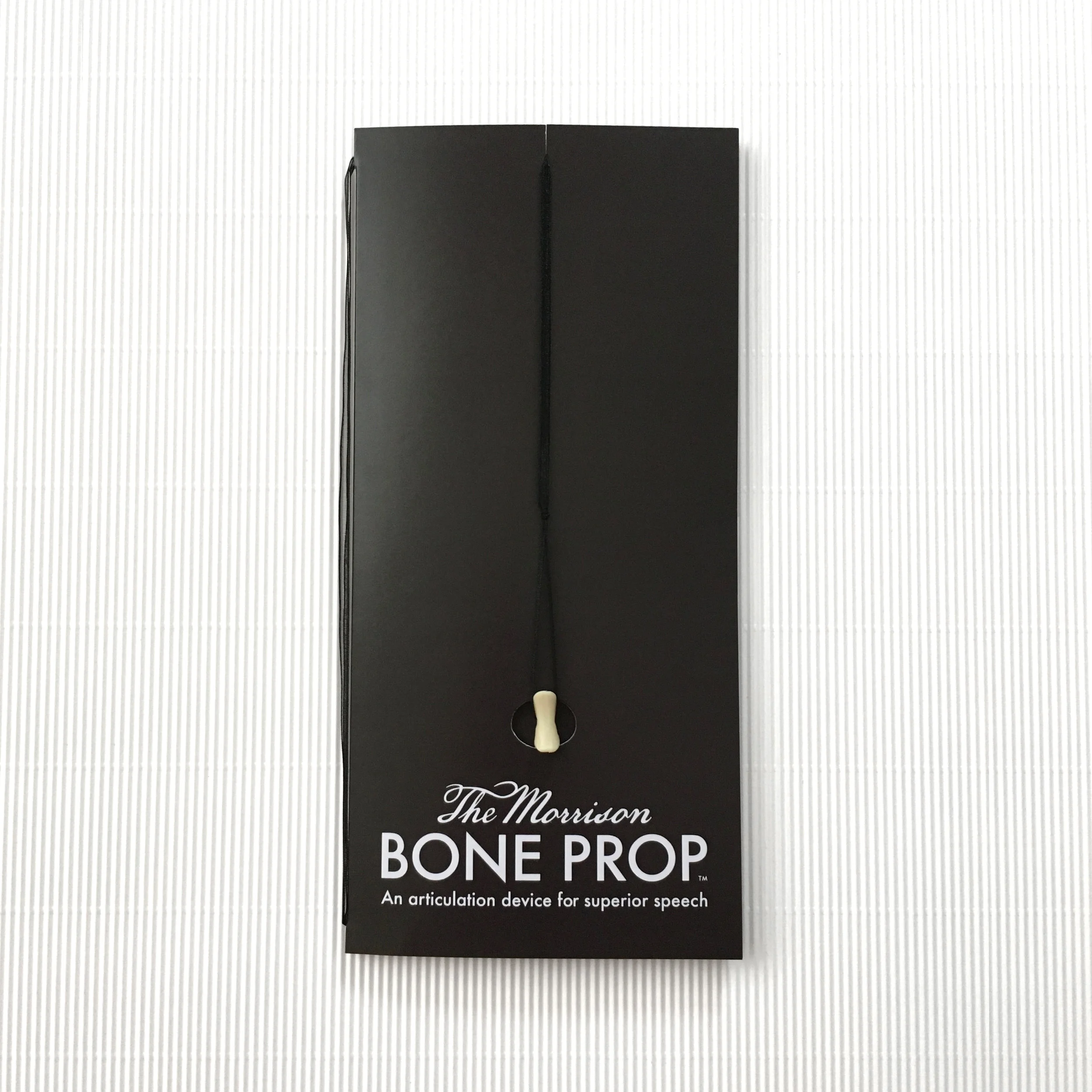 BONE PROPS WITH BLACK RIBBON