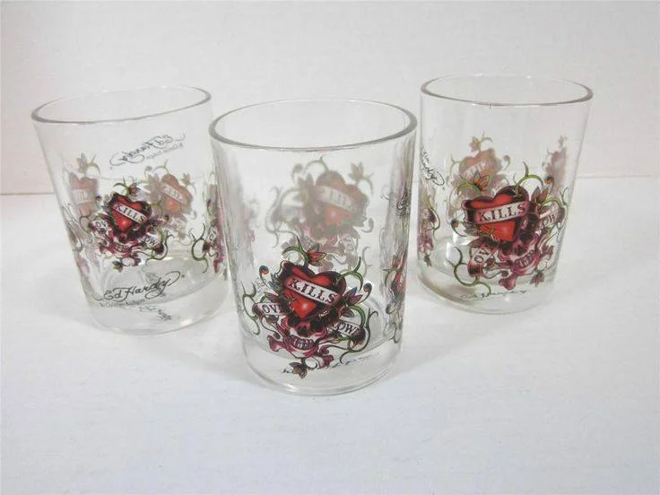 Set of 4 Ed Hardy glasses.