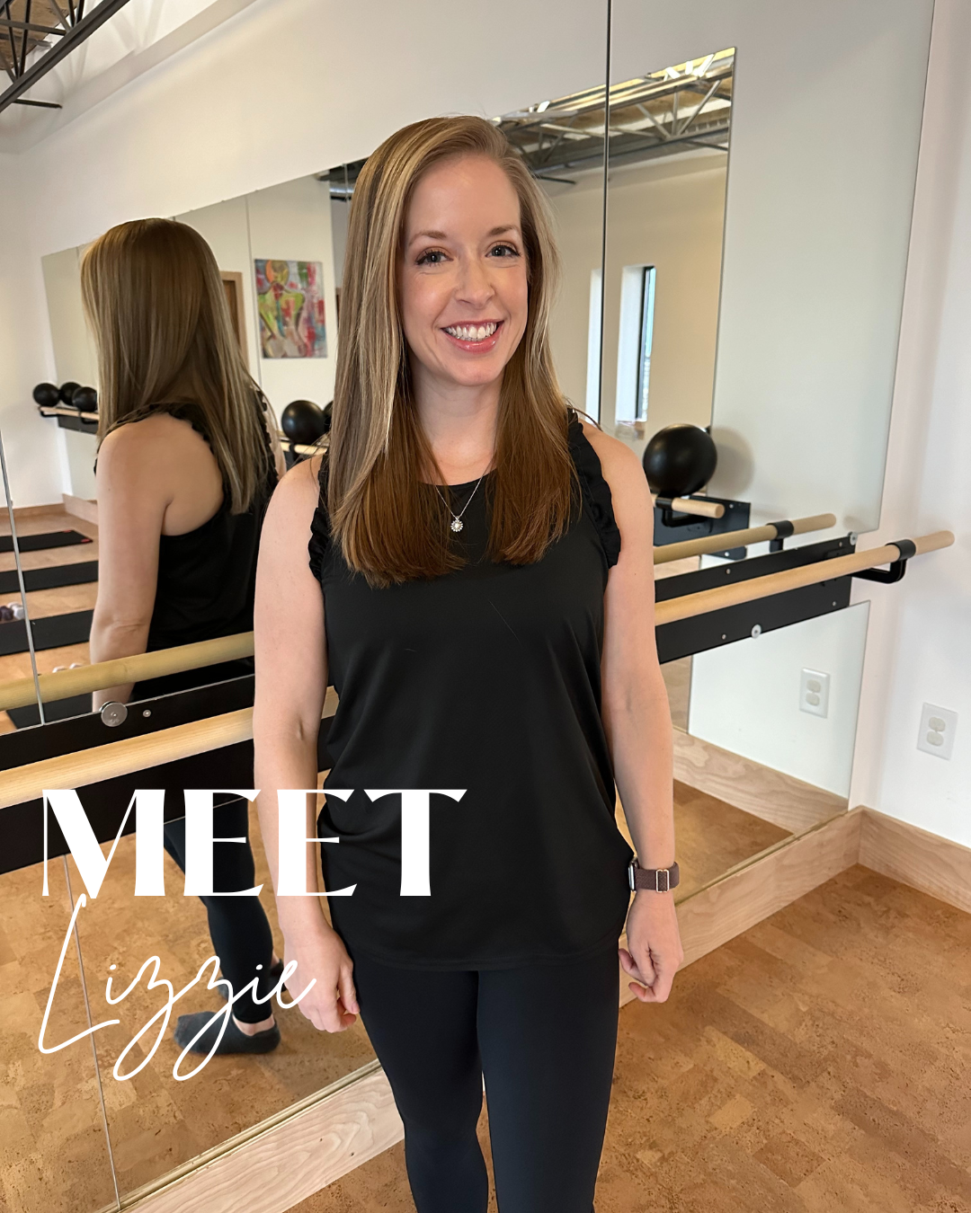 A woman with long light brown hair, wearing a black sleeveless top, smiling at the camera, standing in a fitness studio with mirrors, ballet barre, exercise balls, and colorful artwork on the wall. The text 'Meet Lizzie' is overlaid.