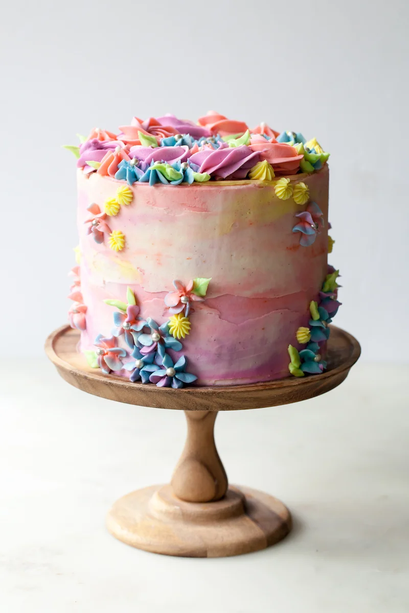 Sprinkle+Birthday+Cake+with+vanilla+pastel+buttercream+swirls.jpg