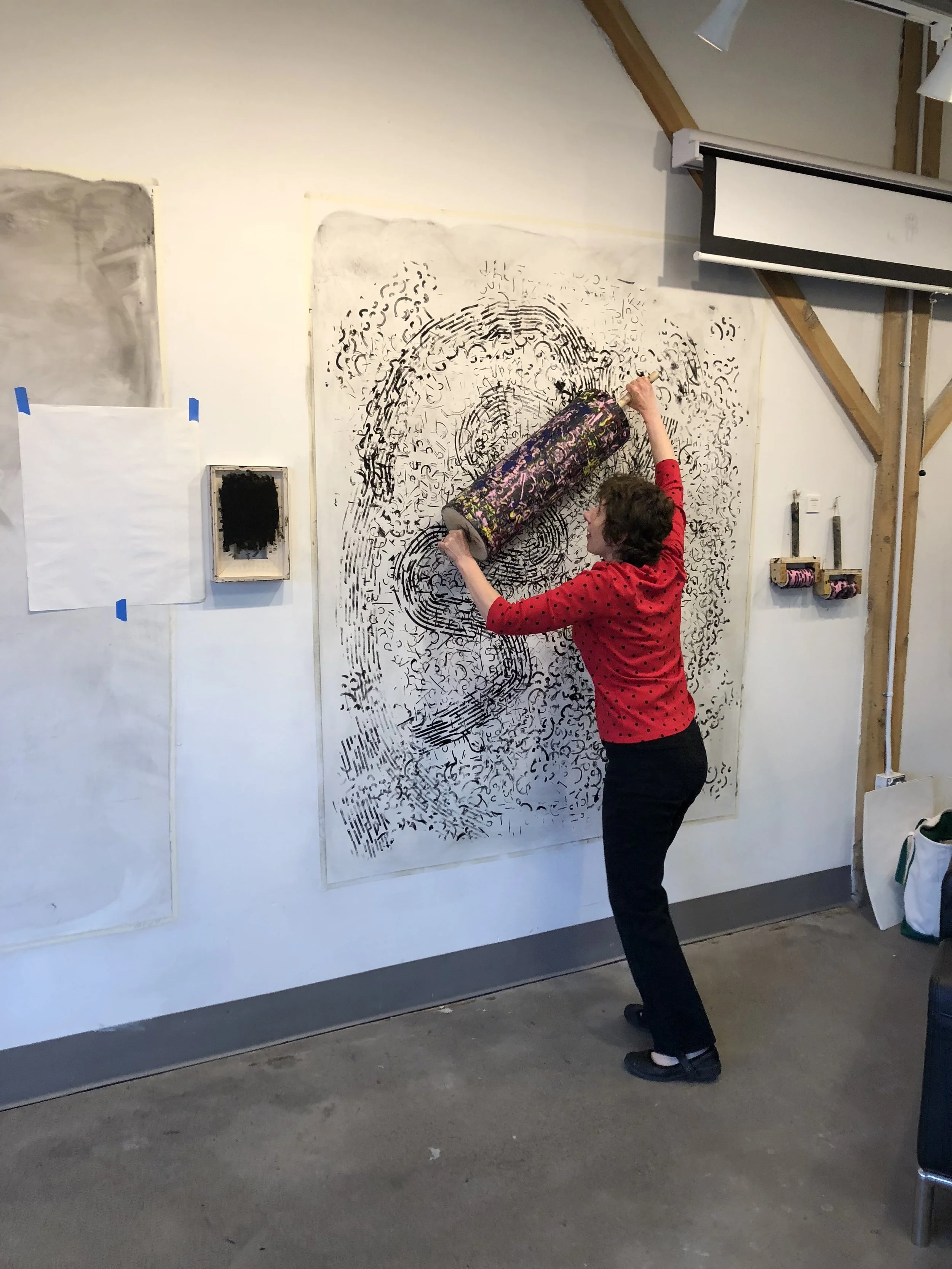 Participant printing with Worob's homemade print rollers. Image courtesy of the artist.