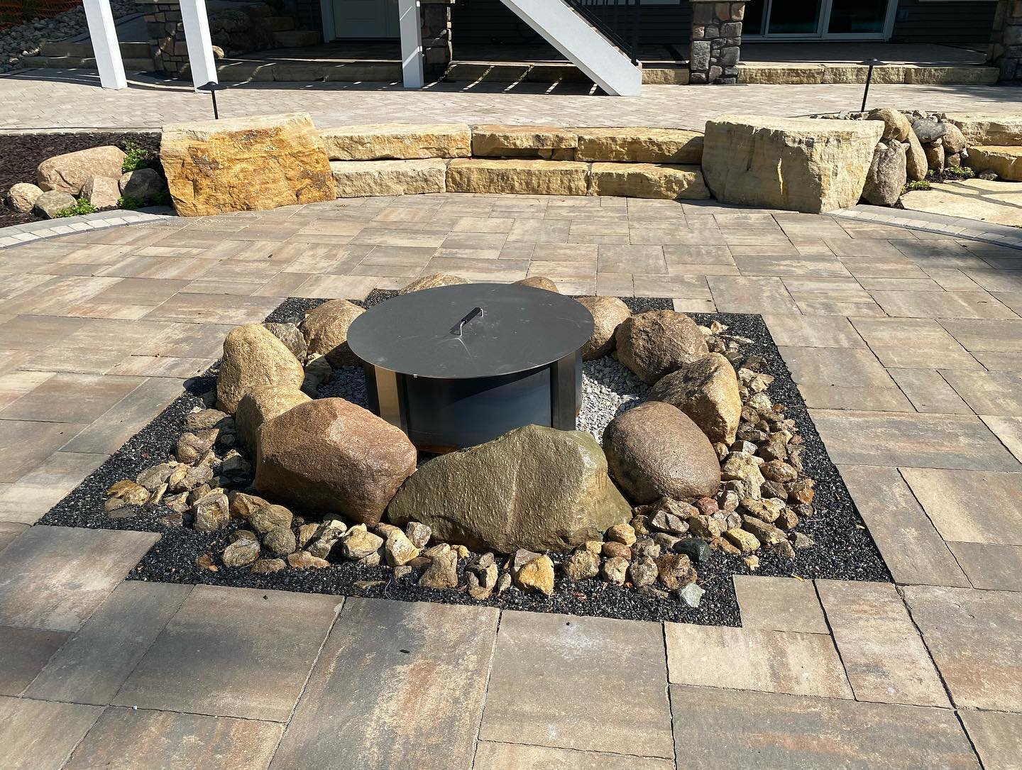 Details of a collaborative effort with our great crews, the homeowners and other contractors. This Hardscape we designed and installed was a joy for us to be involved with. The fire pit detail was designed as a large drain for the upper patio using a