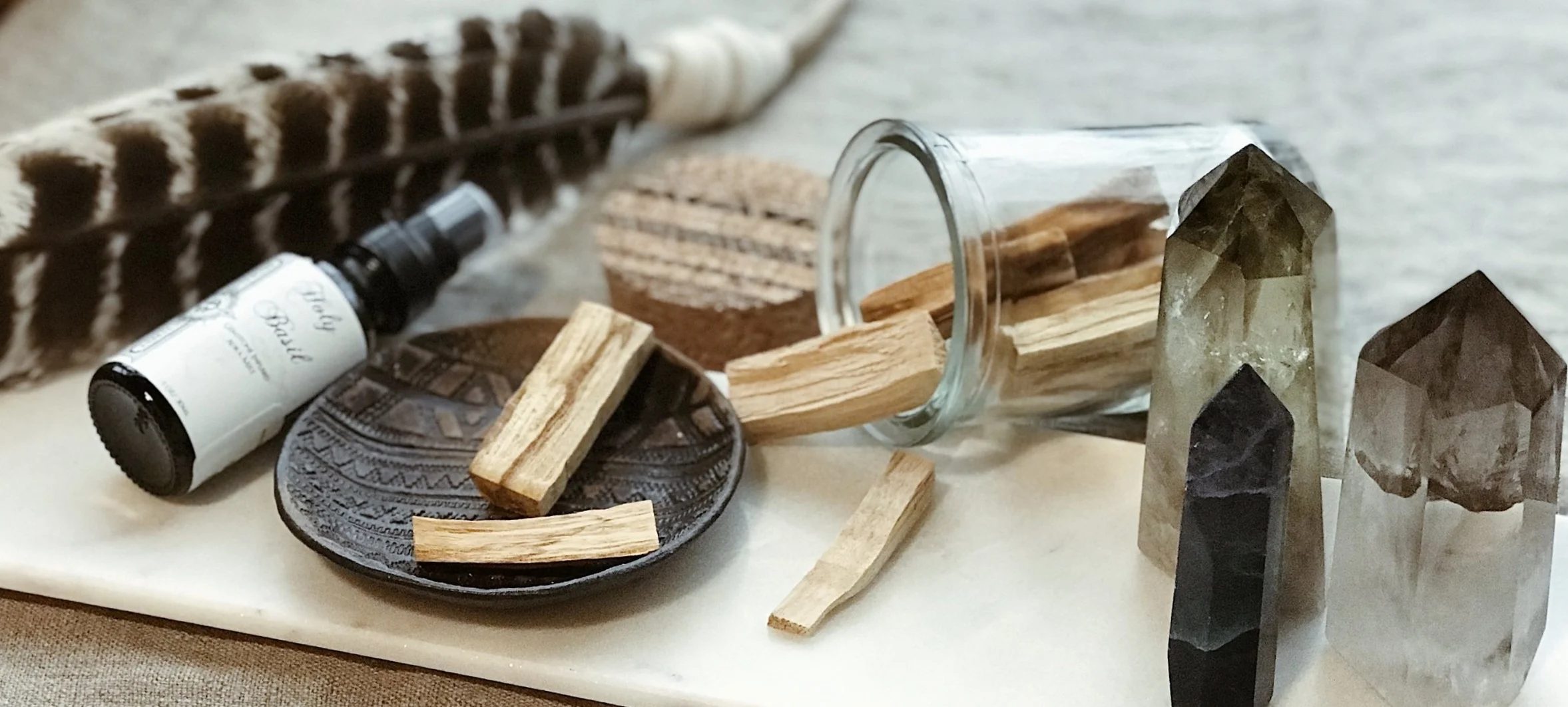 Smudge feather/fan, smudge spray, palo santo sticks, smoky quartz, citrine quartz, labradorite