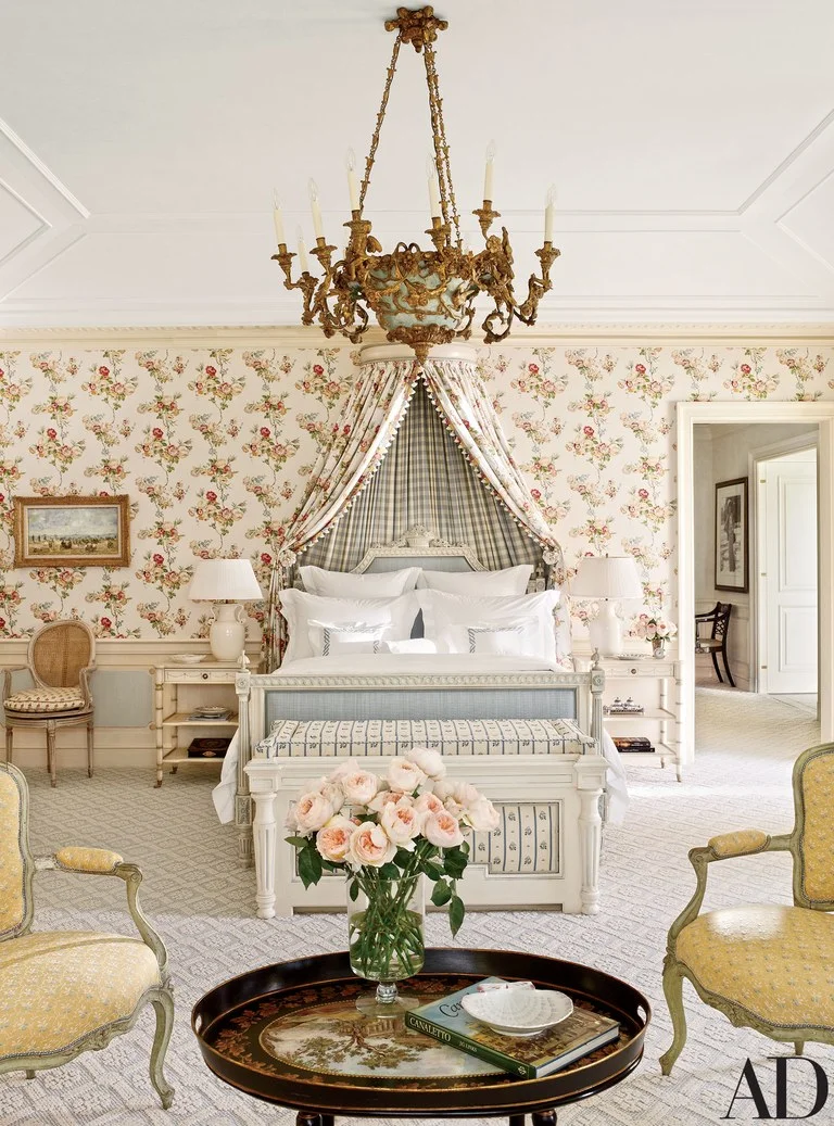 The master bedroom is punctuated by a circa-1790 Piedmontese chandelier from Scott Barnes Antiques; the carpeting is by Patterson Flynn Martin.