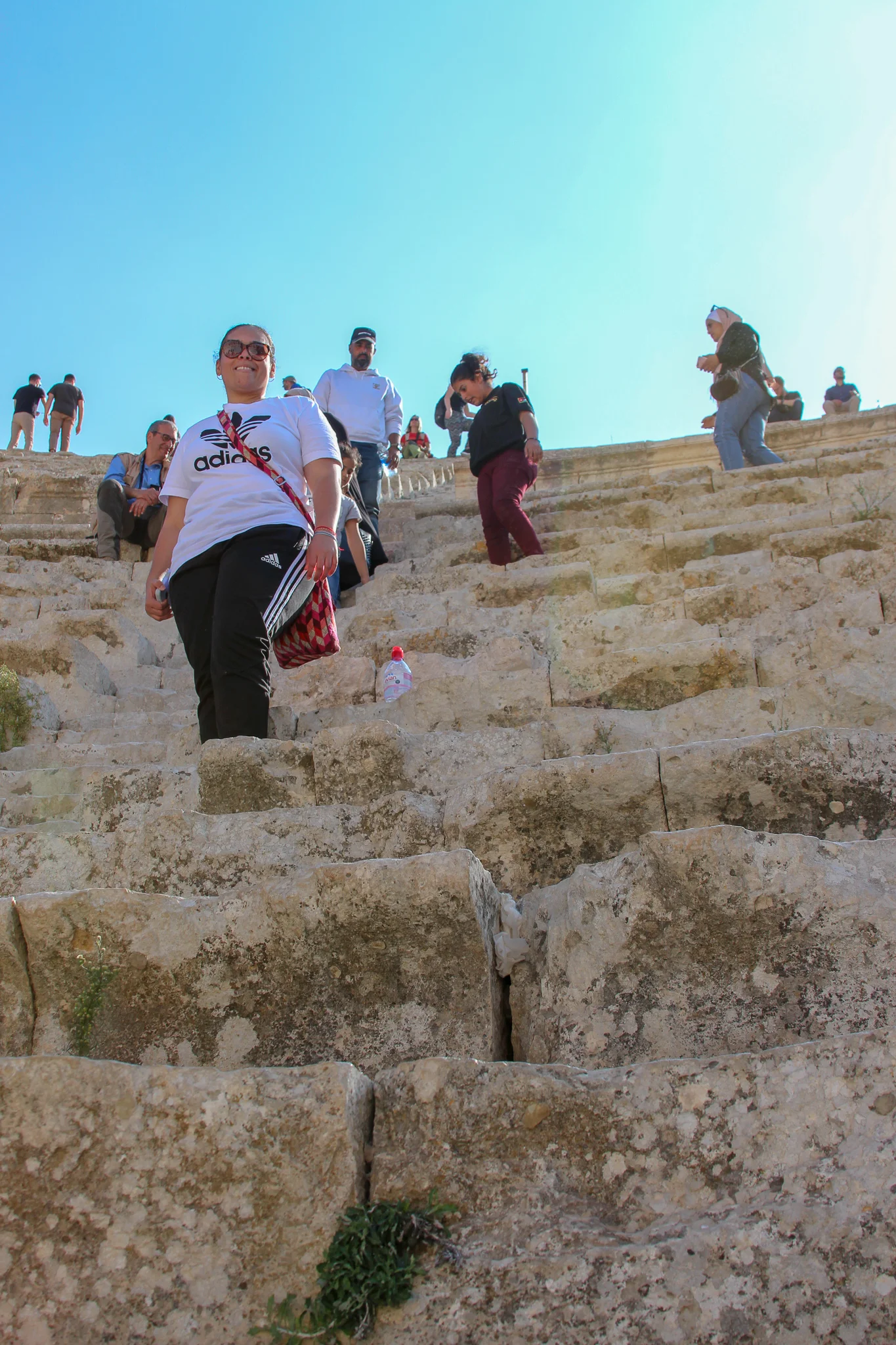 Standing on the steps of the colosseum in Jerash.