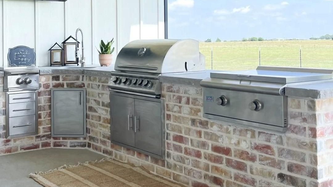 Outdoor kitchen details! Brick outdoor kitchen with stone chiseled countertops!.jpg