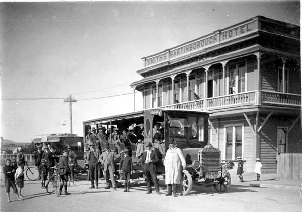 Historical photo of The Martinborough Hotel with buses outside for the races
