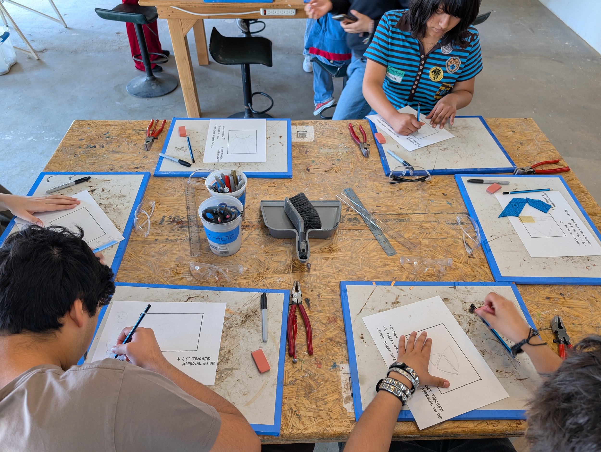 Students taking a stained glass workshop  at Element Art Center, 2026
