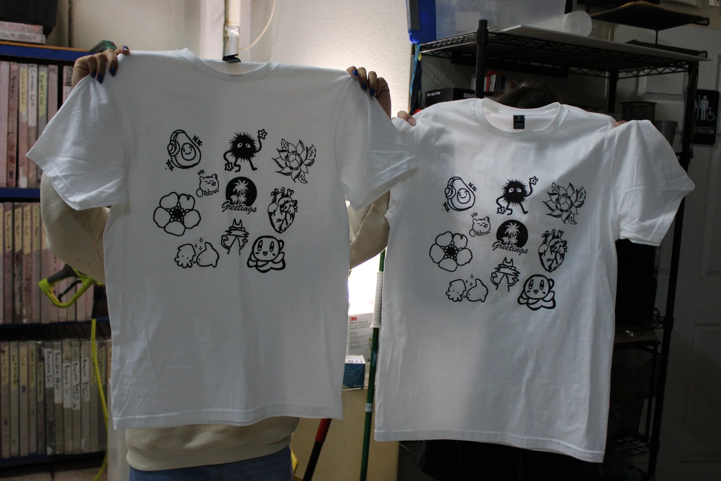 Students displaying their silkscreened shirts at Culivarte Studios, 2024