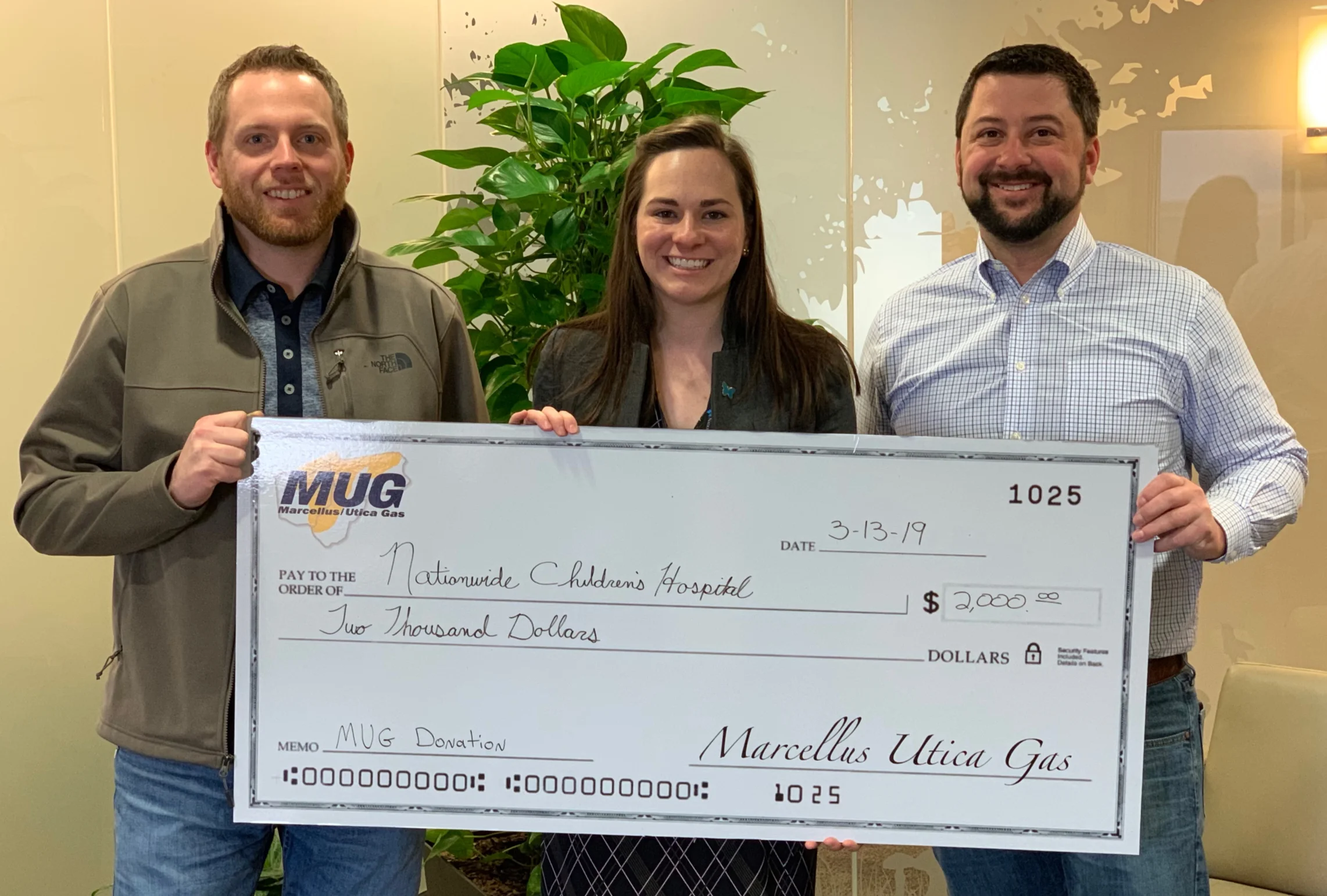 MUG Board Members Chris LaBarte and Zane Johnson present a check to Nationwide Children’s Hospital in Columbus, OH.