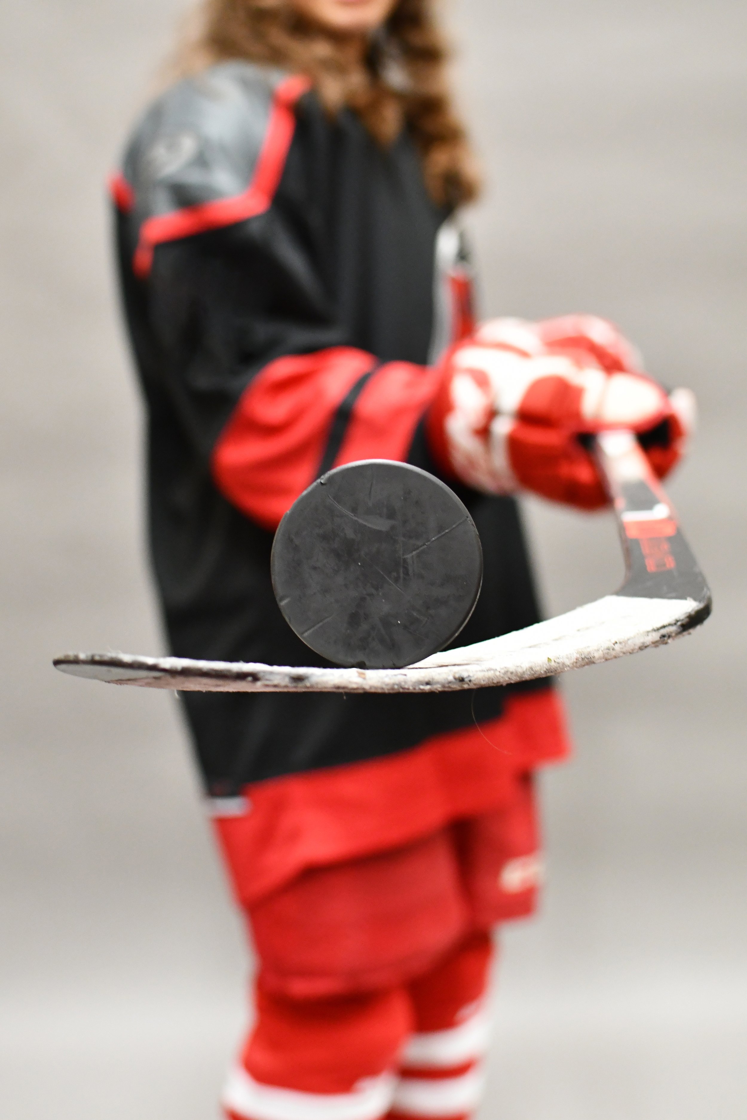 young-hockey-player-holding-stick-and-puck-2026-03-13-04-21-46-utc.jpg